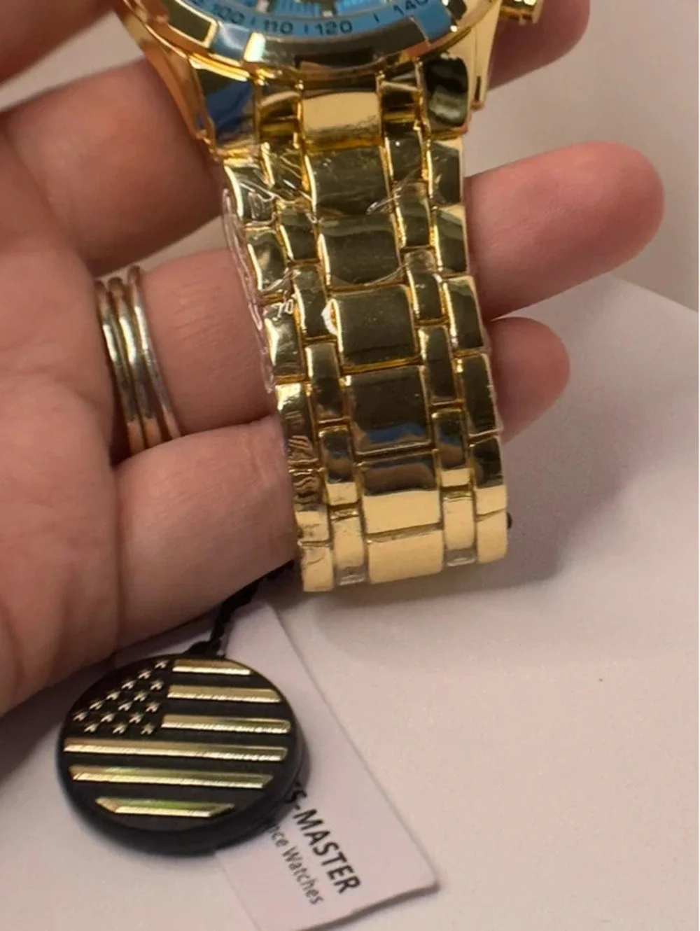 AJ heavy stainless steel, gold tone, blue face Sports Master